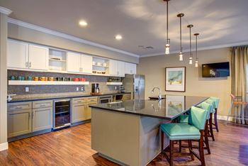 Kitchen with a large center island with a breakfast bar at Northshore Apartment Homes, Portland, TX, 78374